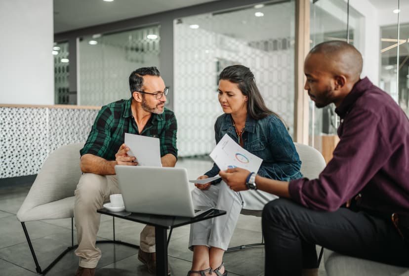 Founders and investors collaborating in a modern office